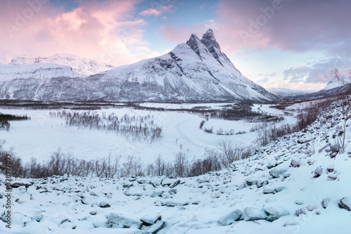 Panorama of snowy fjords and mountain range, Senja, Norway Amazing Norway nature seascape popular tourist attraction. Best famous travel locations. beautiful sunset within the amazing winter landscape © Michal