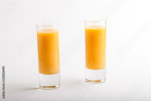 Sweet egg liqueur in glass isolated on white background. Side view