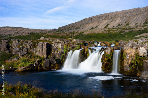Iceland waterfall closeup view of the gods cliff with long exposure smooth motion of water in summer landscape