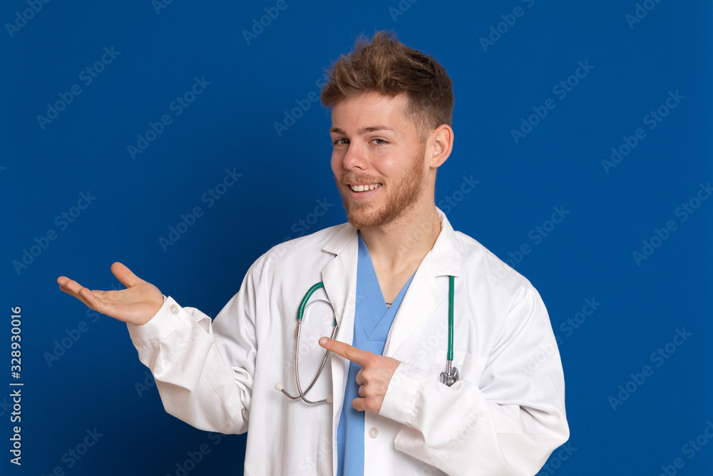 Attractive doctor with white lab coat on a blue background Attractive doctor with white lab coat on a blue background