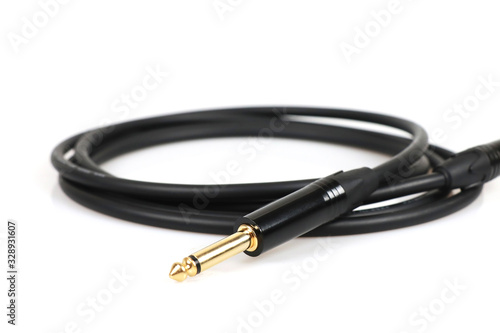 Schilderij op canvas electric guitar audio jack with black cable isolated on white background