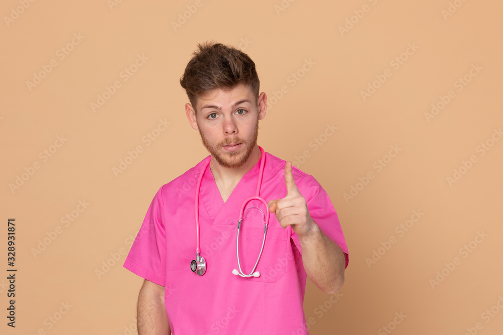 African doctor wearing a pink uniform on a yellow background African doctor wearing a pink uniform on a yellow background