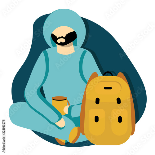 Man with dark beard in blue sport suit  with hood and yellow cup of tea on the camping. Bright character traveler with tarpaulin backpack on dark blue background.  Concept active vacation, trekking
