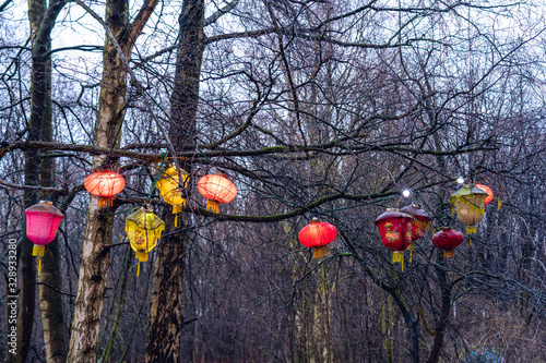 The entrance of an ancient Confucius Temple in Taiwan is decorated with colorful paper lanterns, which read 'wind, rain, good luck' for the Chinese New Year. photo