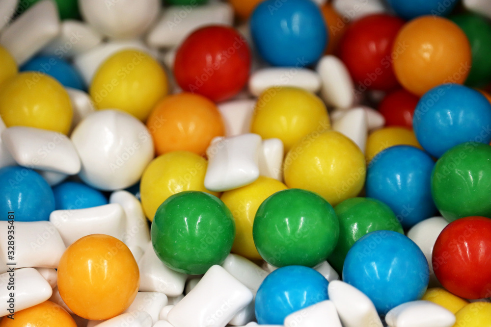 Chewing gumballs, colorful jelly candy. Green, yellow, blue and white gummy marmalade for background Chewing gumballs, colorful jelly candy. Green, yellow, blue and white gummy marmalade for background