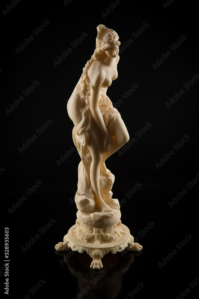 Fototapeta premium plaster sculpture on a black background