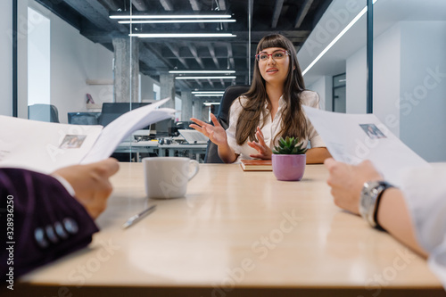 Young college graduate fighting for a new business internship program in front of experienced recruiters