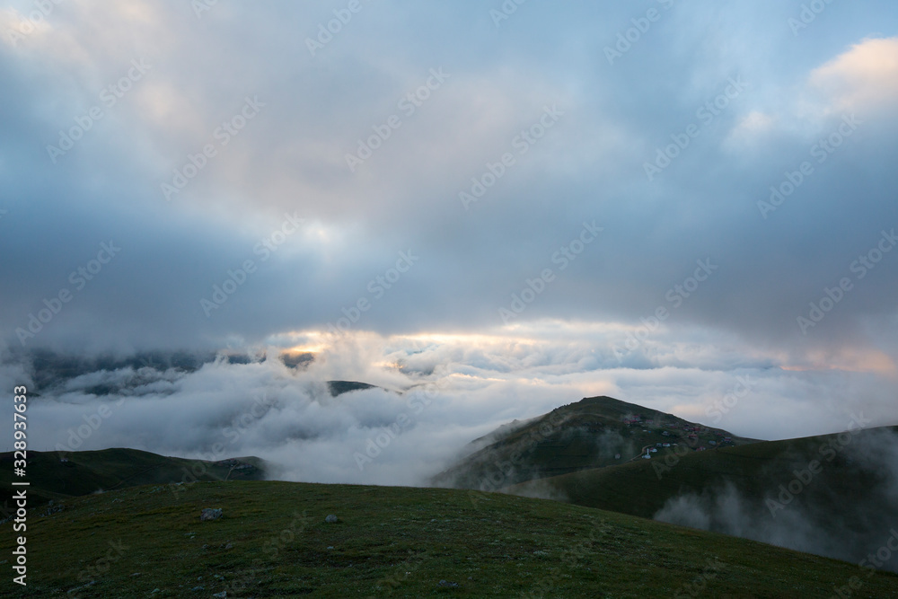 grassy trail and foggy mountain landscape grassy trail and foggy mountain landscape