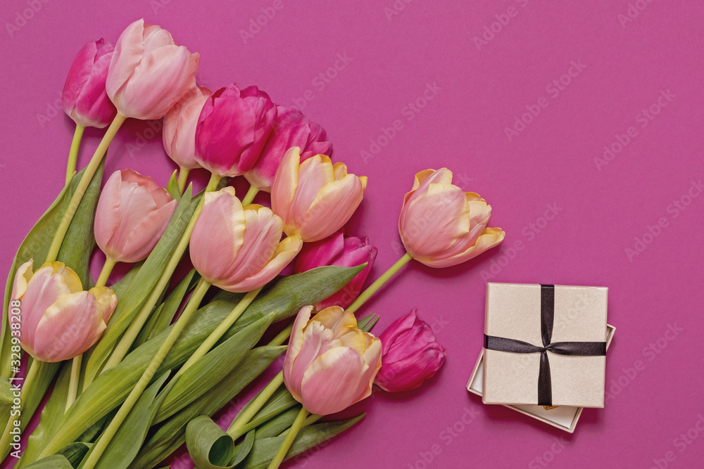 Greeting card with colorful spring tulips flower. Holiday bouquet. Concept of Mother's Day, Birthday or Valentine's Day celebrations. Top View, Flat lay