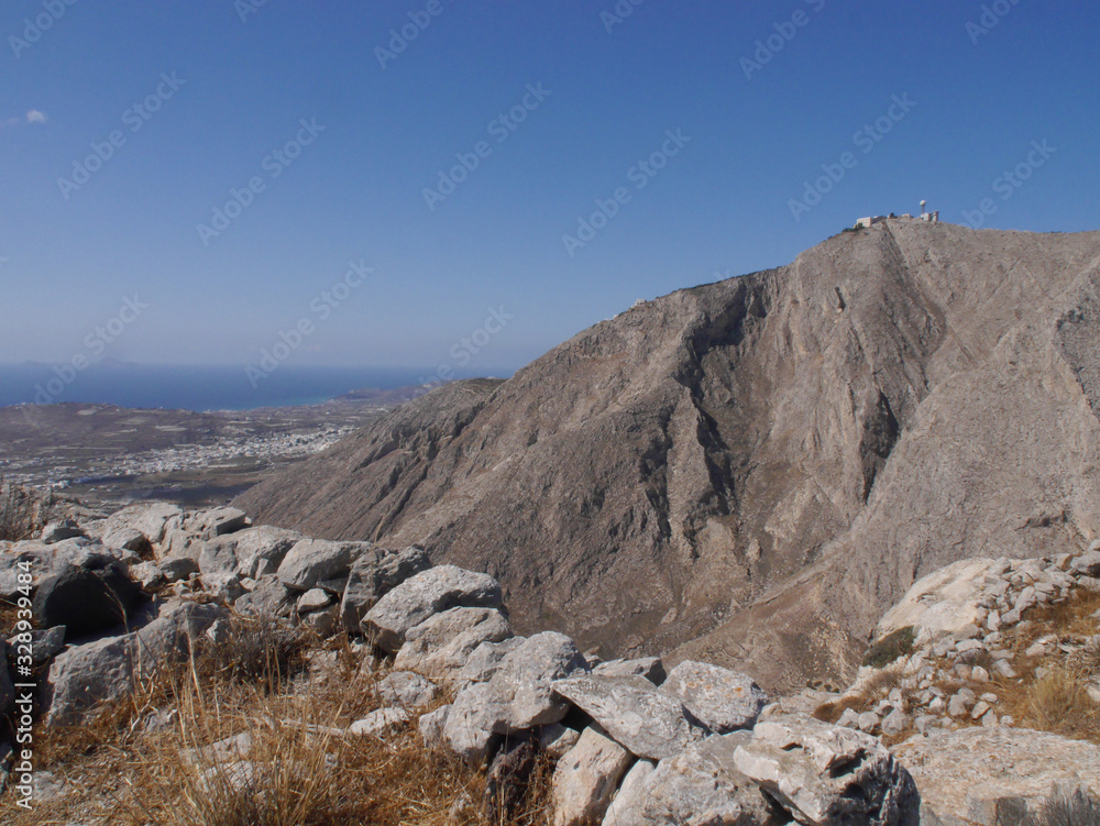 Panoramic view of Santorini island from the top of Mesa Vouno Mountain. Panoramic view of Santorini island from the top of Mesa Vouno Mountain.