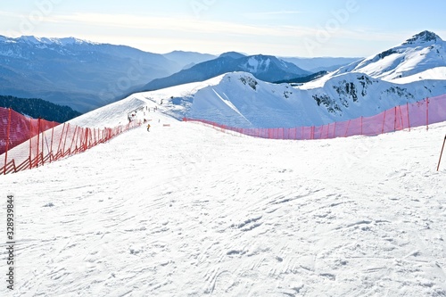  top view of a high mountain gorge with snowy ridges