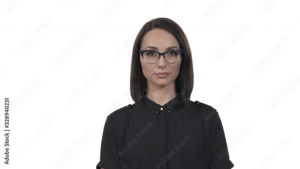 Woman putting on her glasses. Isolated, on white background