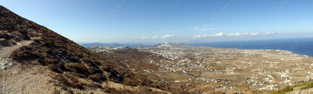 Panoramic view of Santorini island from the top of Mesa Vouno Mountain. Panoramic view of Santorini island from the top of Mesa Vouno Mountain.
