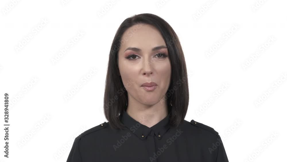 Portrait shot of a young beautiful Caucasian woman eating macadamia nut. Healthy nutrition concept. Isolated, on white background Portrait shot of a young beautiful Caucasian woman eating macadamia nut. Healthy nutrition concept. Isolated, on white background
