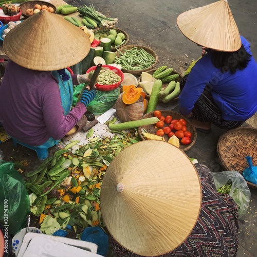 fresh fruit and vegetables merchants at vietnamese market