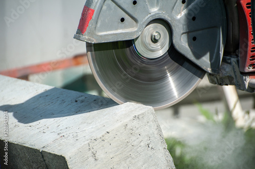 Fragment of a joint cutter on a brushed concrete surface.