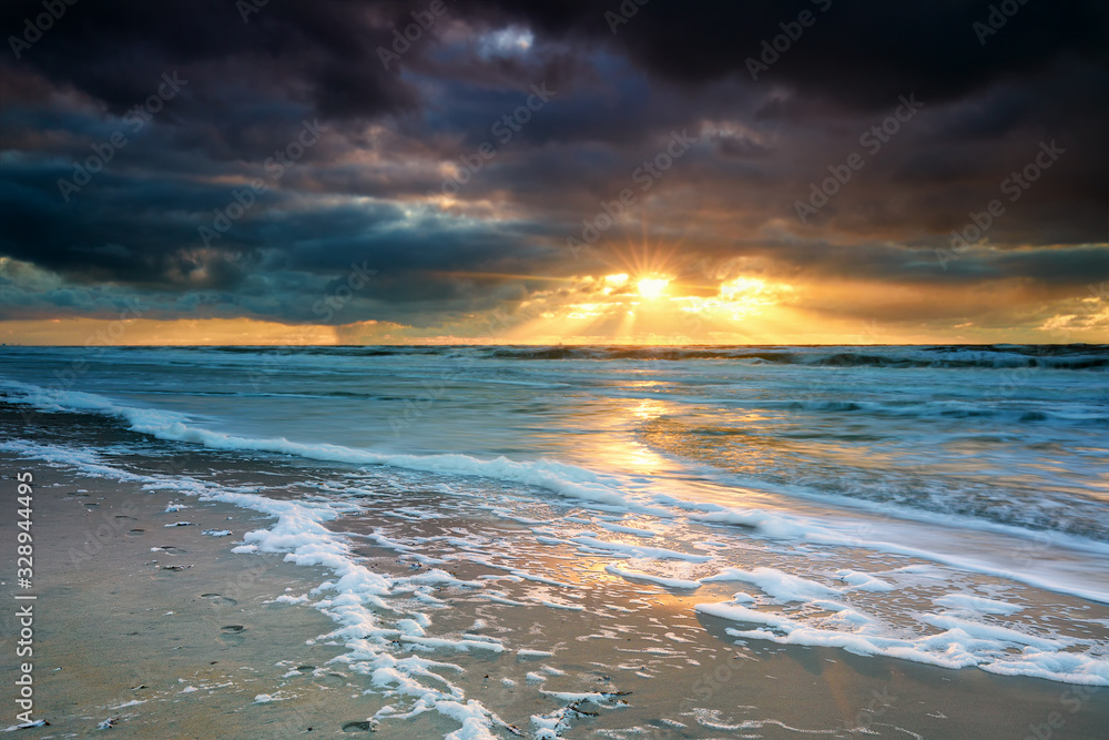 dramatic sunset over North sea waves