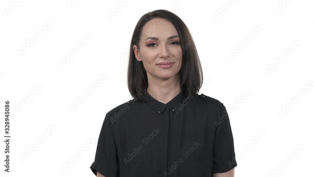 Cheerful woman pointing with index fingers to the camera. Hey you! gesture. Body language concept Cheerful woman pointing with index fingers to the camera. Hey you! gesture. Body language concept