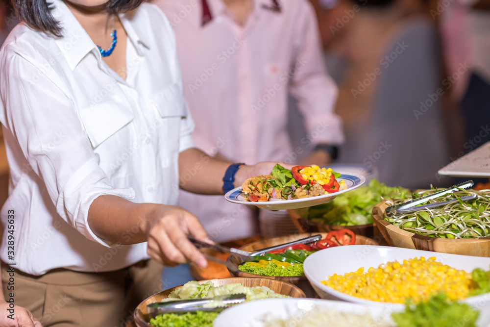 Food Buffet Catering Dining Eating Party Sharing Concept.people group catering buffet food indoor in luxury restaurant with meat colorful fruits and vegetables Food Buffet Catering Dining Eating Party Sharing Concept.people group catering buffet food indoor in luxury restaurant with meat colorful fruits and vegetables