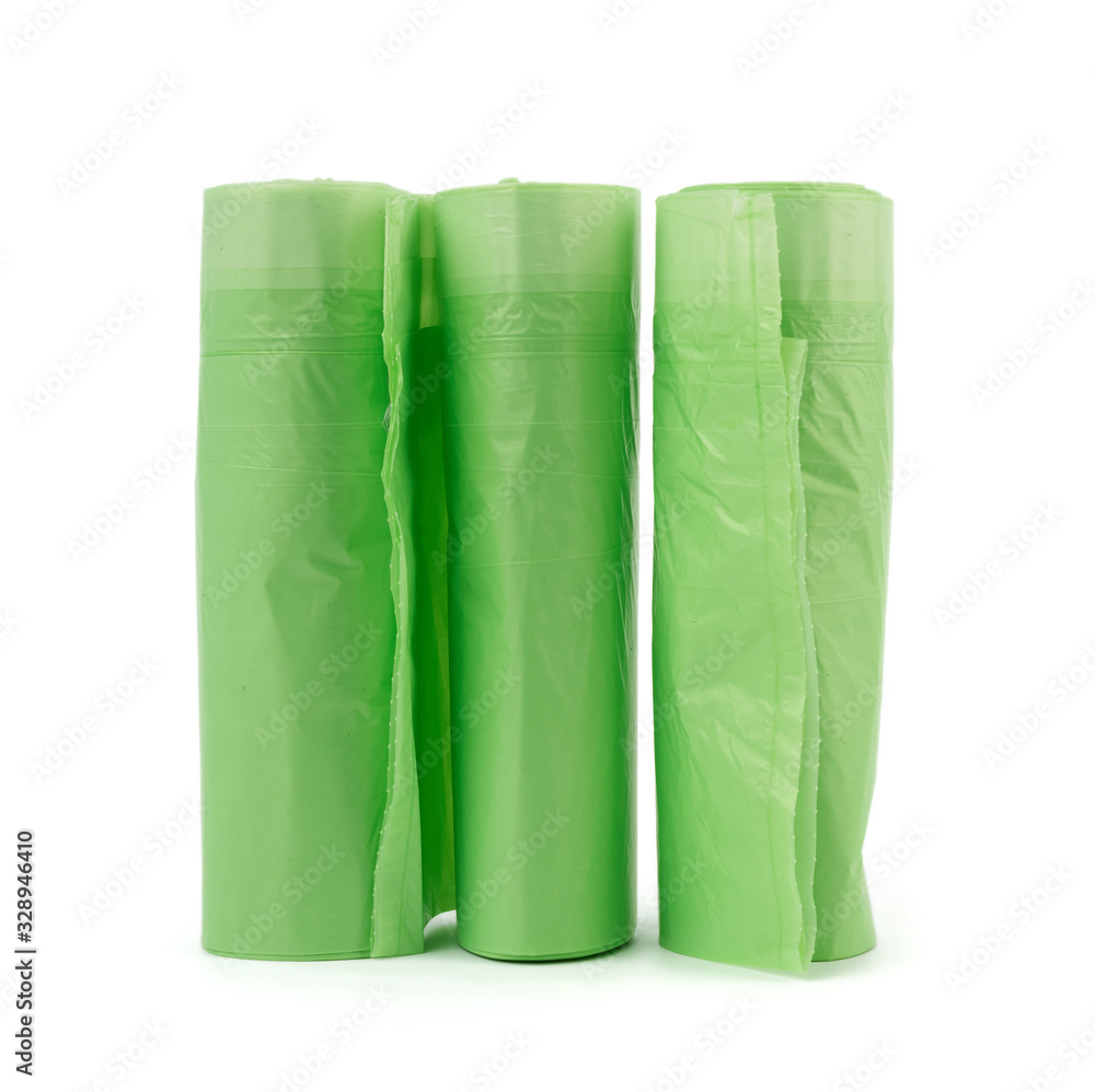 three rolls with green plastic bags for trash bin isolated on white background three rolls with green plastic bags for trash bin isolated on white background
