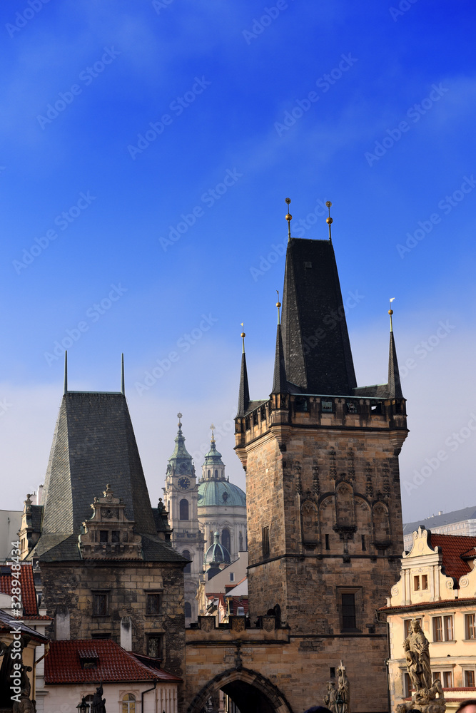 view from the Charles Bridge landmark looking towards Lesser Town with the bridgetower in the foreground and St. Nicholas church in the background, Prague, Czech Republic view from the Charles Bridge landmark looking towards Lesser Town with the bridgetower in the foreground and St. Nicholas church in the background, Prague, Czech Republic