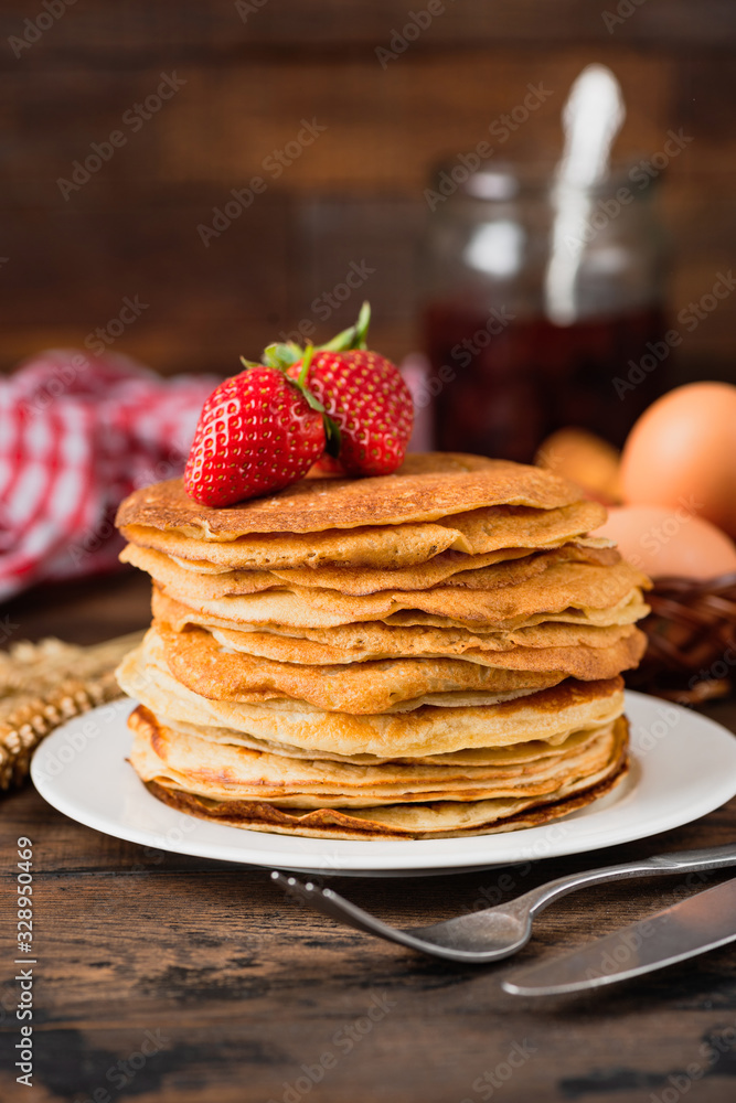 Russian Blini or Crepes or Thin Pancakes on wooden table background Russian Blini or Crepes or Thin Pancakes on wooden table background