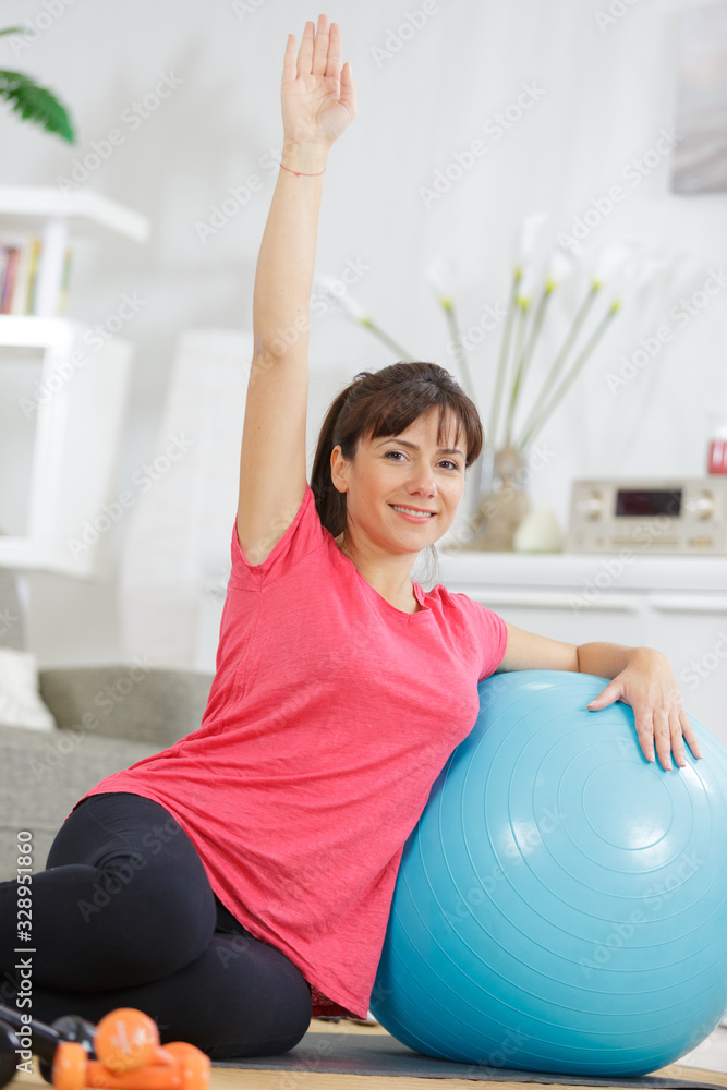 young woman training with fitness ball young woman training with fitness ball