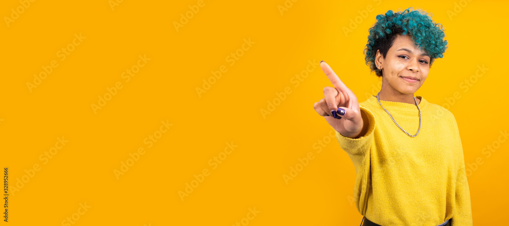 young african american girl or woman isolated on color background with space for advertisement or text young african american girl or woman isolated on color background with space for advertisement or text