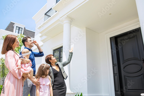 Businesswoman showing new house to the family