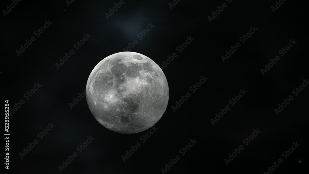 the moon is bright in the dark sky. the moon is bright in the dark sky.