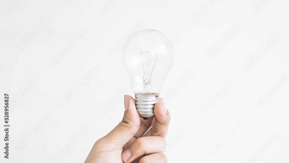 Closeup of hand holding light bulb Closeup of hand holding light bulb