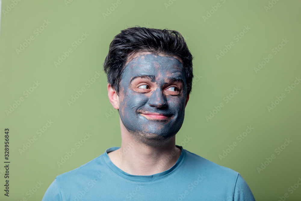 guy in a face care mask