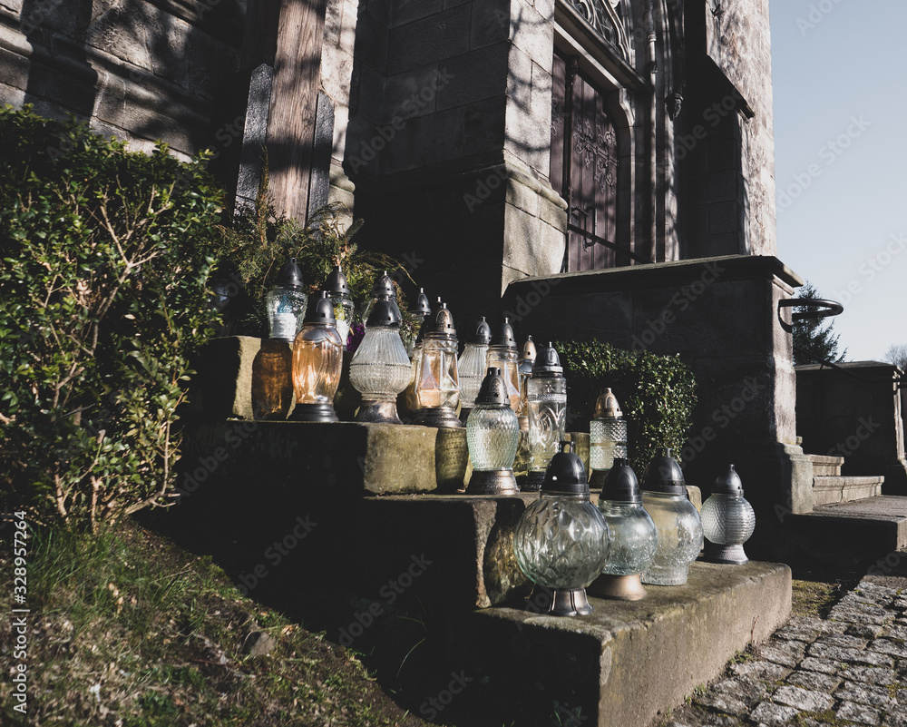 Fototapeta premium little glass lamps on stairs of chuch in Poland