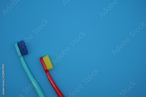 Tooth brushes on blue background