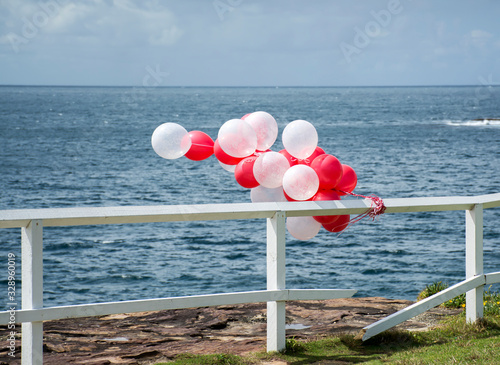 Colorful balloons over the sea