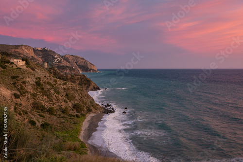Landscape of a rocky coast with sunset colors