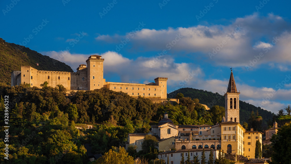 The ancient city of Spoleto in Umbria, with it most famous medieval landmarks and sunset golden light