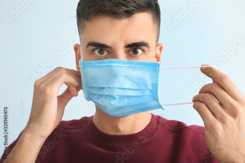 Young man with protective m...