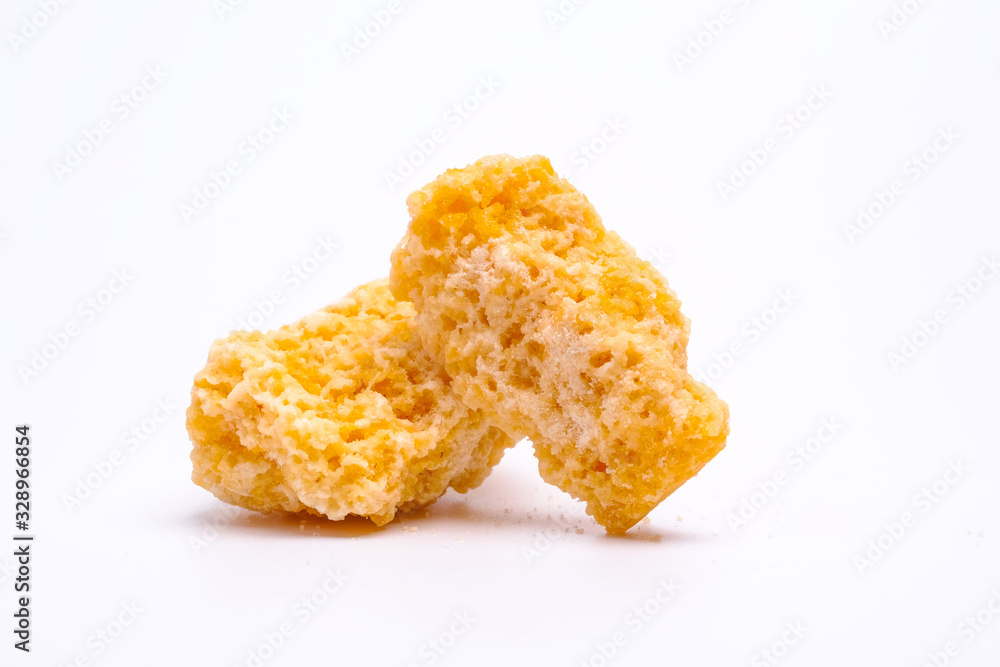 Honeycomb sugar as alternative sweetener on isolated white background. Honeycomb sugar as alternative sweetener on isolated white background.