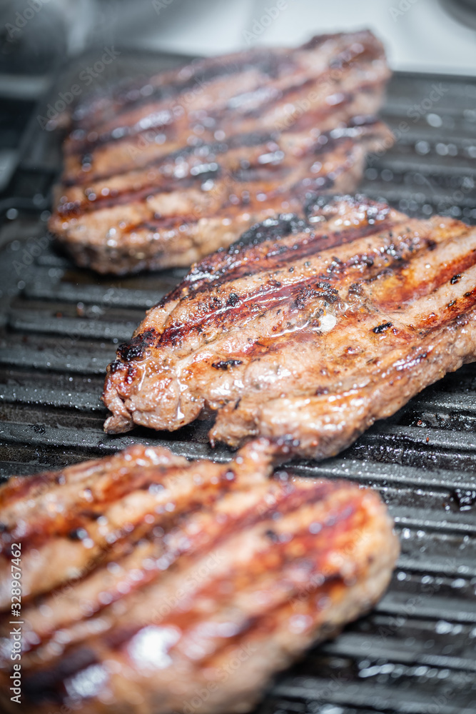 Juicy grilled meat steaks.