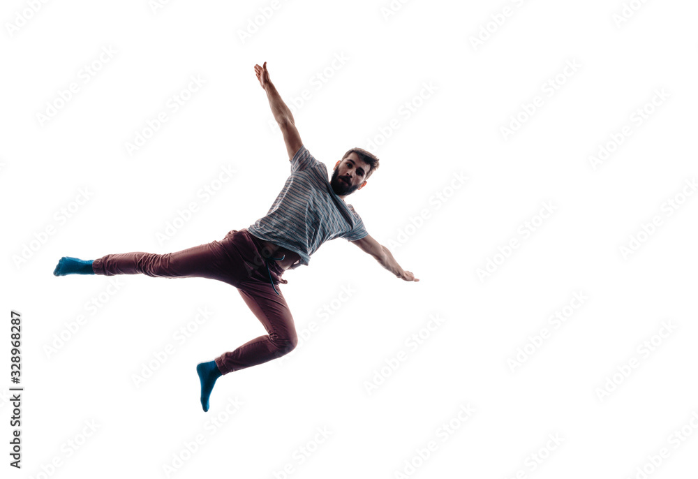 Modern dance performer practicing modern dance on white wall Modern dance performer practicing modern dance on white wall