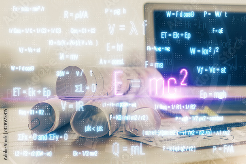 Desktop computer background and formula hologram writing. Double exposure. Education concept.