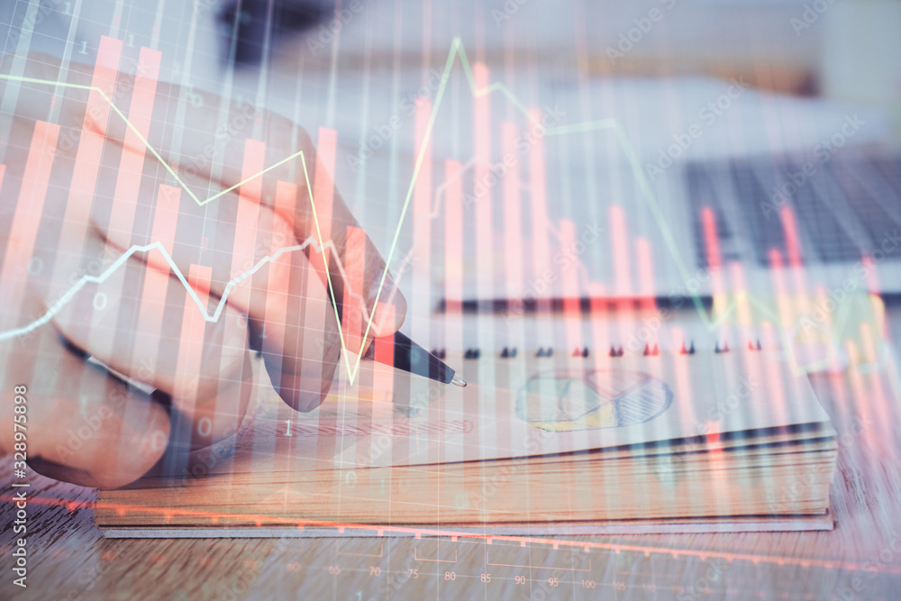 Multi exposure closeup hands with stock market forex graph. Multi exposure closeup hands with stock market forex graph.