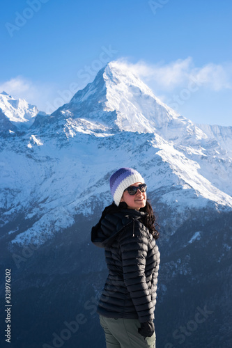 Woman on the background of mountain peaks in Himalayas, Nepal. Annapurna, poon hill circuit.