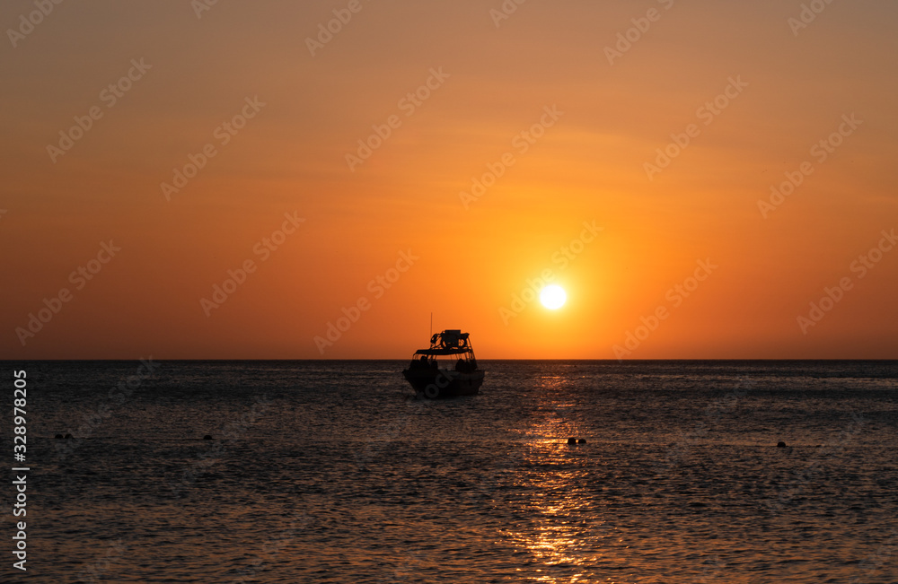 sunset on the beach with boats sunset on the beach with boats
