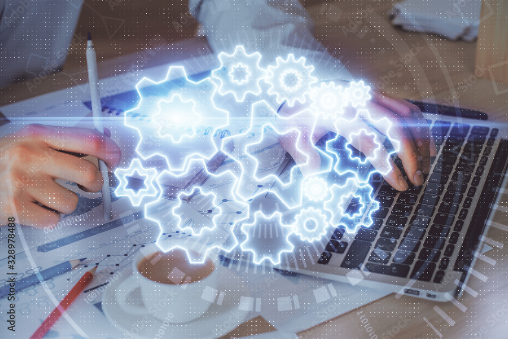 Double exposure of businessman working on laptop on background. International business hologram in front. Concept of success. Double exposure of businessman working on laptop on background. International business hologram in front. Concept of success.