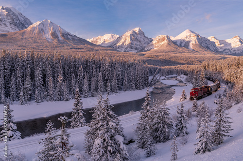 Sunrise and trains at Morants Curve in Banff National Park, Alberta, Canada photo