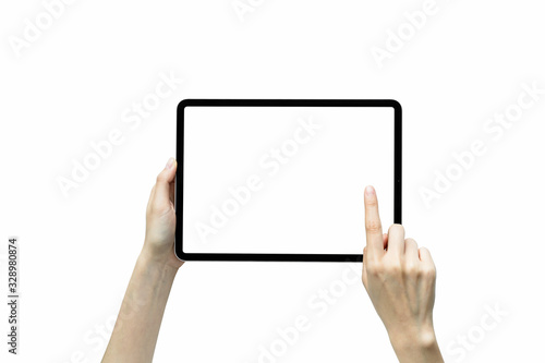 Close-up of hand holding black tablet isolated on white background.