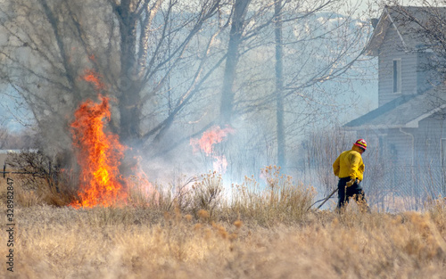 Firefighter Saves Home from Brush Fire