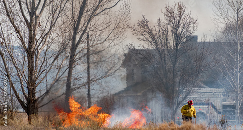 Firefighter Saves Home from Wildfire